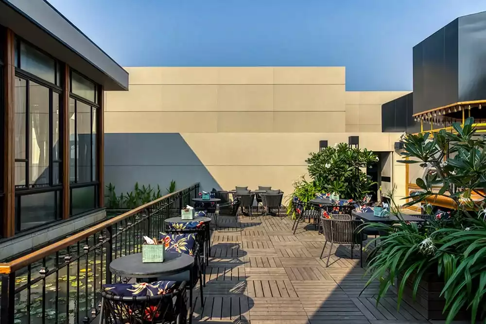Taj City Centre Hotel outdoor cafe built with High density fibre board | Everest Industries